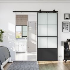 an open door leading to a bedroom with white walls