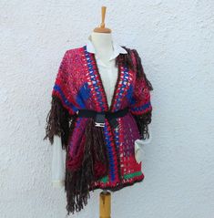 This art to wear Sweater is legendary Frida Inspired multicolor designed and knitted by hand. It has mealy purple,crimson red, navy blue, green colors and brown fringes. Be yourself with this Hippy Sweater Artwork! Use it with your jeans, shorts, ethnic clothes, in fall, spring and winter with simple base clothes! It has mediumweigt yarn so is suitable for seasonal wear. SUPRISE! Be ready for your gift randomly added to your package :) We offer always free shipping and additional gifts only for Hippy Sweater, Witchy Wednesday, Abstract Art Green, Fringed Cardigan, Hippie Sweaters, Ethnic Clothes, Knit Items, Upcycle Clothes Diy, Chic Sweater