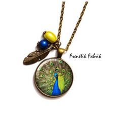 a necklace that has a peacock on it