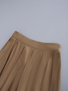 This Cotton Pleated Skirt-Tan is a must. The classic pleated design adds a touch of sophistication, making it perfect for both casual and formal occasions. Elegant Workwear Skort With Accordion Pleats, Spring Solid Pleated Skirt With Pleated Hem, Elegant Summer Skort In Solid Color, Elegant Mini Skort In Solid Color, Elegant Solid Color Pleated Mini Skirt, Elegant Spring Skort With Pleated Hem, Elegant Solid Color Mini Pleated Skirt, Elegant Solid Color Mini Skort, Elegant Skort With Pleated Hem