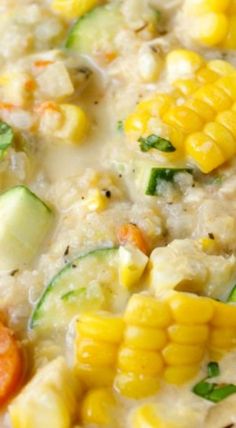 corn, zucchini, and carrots are mixed together in a white sauce