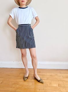 Vintage white and navy stripe skirt with front pockets. So summer! Pair it with a white tee! made in France Size tag size FR 38 100% cotton Waist: 13" Hip: 19" Length: 17.5" Striped Lined Skirt For Workwear, Striped Lined Skirt Bottoms For Workwear, Summer Workwear Skirt With Vertical Stripes, Summer Striped Lined Skort, Striped Lined Skort For Summer, Navy Cotton Lined Skirt Bottoms, Navy Cotton Summer Skirt, Fitted White Skirt With Striped Hem, White Cotton Skirt With Side Pockets