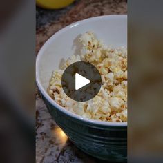 a bowl filled with popcorn sitting on top of a counter