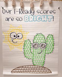 a bulletin board with a drawing of a cactus and a sun on it that says our i - ready scores are so bright