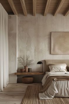 a bed sitting in a bedroom on top of a wooden floor