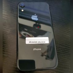 an iphone with the xr - aggi unlock button on is sitting on a table