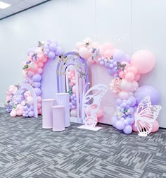 a room with balloons and decorations on the wall