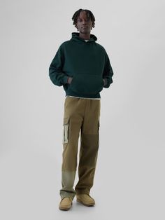 Soft, stretch cotton twill cargo pants.  Elasticized waist with drawcords.  Front slant pockets, back welt pockets.  Side cargo pockets.  Ties at hem for cinching.  Allover patchwork detailing.  This pant is made with 98% regenerative cotton, which is grown using holistic agricultural practices that improve soil health, climate resilience, water retention, and local biodiversity.  This product was made in a factory that invests in gender equality and women’s empowerment.  Through RISE Reimaginin Sporty Gap Sweatpants For Streetwear, Sporty Gap Bottoms With Side Pockets, Sporty Green Cargo Pants For Streetwear, Green Utility Parachute Pants With Cargo Pockets, Cotton Utility Sweatpants With Patch Pockets, Utility Cotton Sweatpants With Patch Pockets, Green Cargo Pants With Patch Pockets For Fall, Green Cargo Pants With Side Pockets For Fall, Utility Sweatpants With Hip Pockets