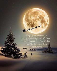 a person walking across a snow covered field under a full moon with santa's sleigh in the sky