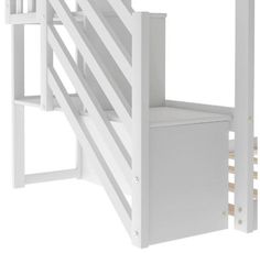 a white bunk bed with stairs on the side