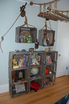 the bookshelf is made out of wooden crates