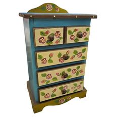 an old dresser with painted drawers on it