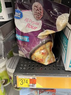 a bag of food sitting on top of a shelf in a store next to other items