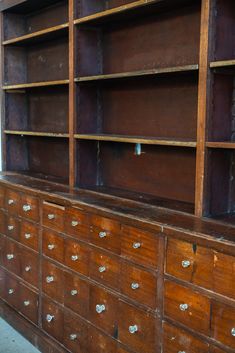 an old wooden dresser with many drawers