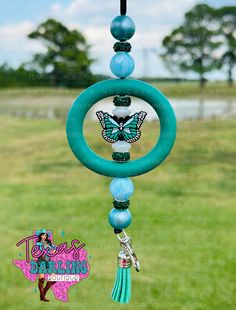 a wind chime with a butterfly on it