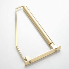 a gold metal door handle on a white background with clippings to the side