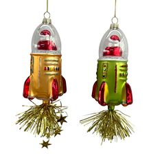 two christmas ornaments hanging from strings with lights and decorations on top of each ornament