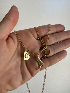 This cowgirl charm necklace is perfect for festival season or just that country girl vibe! with a tiny cowboy hat, boot and horseshoe all components 14k gold filled Gold Western Jewellery, Tiny Cowboy Hat, Cowboy Necklace, Cowboy Accessories, Cowgirl Stuff, Country Jewelry, Girl Vibe, Cowgirl Jewelry, Morgan Wallen