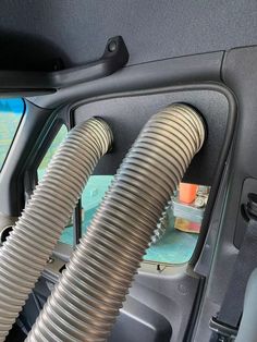 the inside of a car with two hoses attached to it