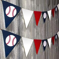 baseball bunting banner with red, white and blue pennants hanging on a wooden fence