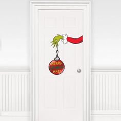 a door decorated with a christmas ornament and dr seuss's hat