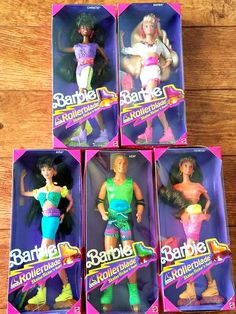 six barbie dolls are in their boxes on the table