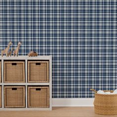 the wallpaper in this room is blue and white checkered with wicker baskets