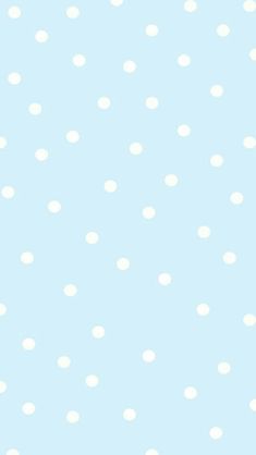 a blue background with white polka dots