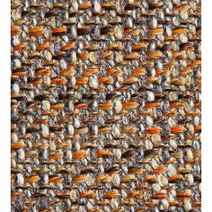 an orange and grey textured fabric with small white dots on the top, in close up