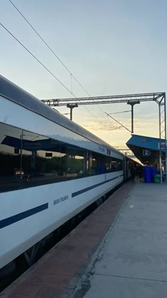 the train is stopped at the station waiting for passengers to get on or off it