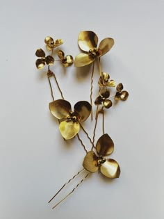 Individual blossom pins of differing sizes and clusters. -gold plated straight pins -brass flowers and gold hematite beading -hand wired and soldered -hand made in France -the largest flower shown is approximately 5cm in diameter -pins are approximately 8.5-9cm long Headpiece Ideas, Hair Mood Board, Jennifer Wood, Bridesmaids Gift Ideas, Wedding Hair Up, Gold Hair Pin, Gold Hair Accessories, Hair Jewels, Hair Adornments