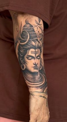 a person with a tattoo on their arm