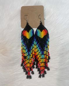 This is a beautiful pair of fringed rainbow earrings. Very lightweight, Rainbow Beaded Fringe Earrings For Gift, Multicolor Fringe Dangle Jewelry, Multicolor Beaded Fringe Chandelier Earrings As Gift, Multicolor Beaded Fringe Earrings As A Gift, Multicolor Beaded Fringe Drop Earrings, Multicolor Fringe Beaded Drop Earrings, Multicolor Beaded Fringe Earrings Gift, Rainbow Fringe Dangle Jewelry, Rainbow Dangle Tassel Earrings Gift