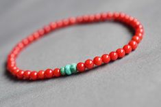 Red coral bead bracelet, red coral jewelry for men and woman - genuine, round coral beads (red dyed) and African turquoise beads - slim style bracelet - 4 mm width - stretch bracelet made with strong stretchy cord, for intense wearing, that stretches gently - fashionable for men and women, wear it single or in a stack - casual piece of jewelry matches with many outfits - easy to put on and off - a nice treat for yourself or a nice gift for friends and family, the bracelet come wrapped in one sat Red Coral Beaded Bracelets With Gemstone Beads, Red Coral Beaded Bracelets, Coral Red Coral Beaded Bracelets, Beaded Red Coral Round Bead Bracelets, Gift-grade Red Coral Beads, Hand-strung Coral Bracelets With Round Beads, Hand-strung Red Coral Beaded Necklace For Gifts, Adjustable Hand-strung Coral Bracelets, Red Coral Jewellery