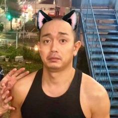 a man with cat ears on his head