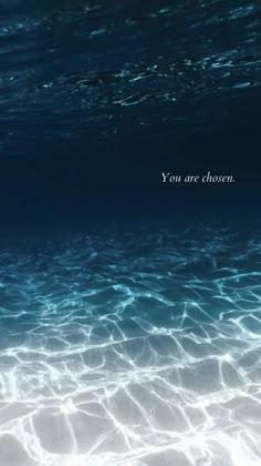 the water is very clear and blue with an inspirational quote above it that says, when all else falls, life doesn '