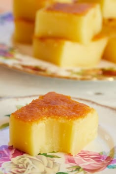 pieces of yellow cake sitting on top of a plate