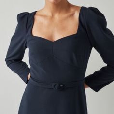 An Elegant Dress Perfect For Early-Season Occasions, Our Katerina Midi Dress Is Understated And Beautifully Cut. Crafted From Navy Stretch Crepe, It Has A Sweetheart Neckline, Puff Shoulders, Bracelet-Length Sleeves, A Nipped Waist With A Buckle Belt, And A Midi Skirt. Wear It With Heels And A Clutch For The Dressier Moments In Your Diary. The Katerina Dress Is Crafted From Navy Blue Crepe. It Has A Sweetheart Neckline, Puff Shoulders, Bracelet-Length Sleeves, A Nipped Waist With A Buckle Belt And A Midi Skirt. Color: Blue Dress Length: Midi Sleeve Length: Long Sleeves Fabric: Polyester Model Height And Size: The Model Is 179 Cm / 5'9" And Is A Uk Size 8 Washing Instructions: Dry Clean Formal Blue Square Neck Dress, Blue Square Neck Formal Dress, Long Sleeve Dress With Fitted Bodice For Brunch, Navy Fitted Midi Dress, Blue Midi Dress With Fitted Bodice For Work, Blue Fitted Bodice Midi Dress For Work, Blue Fitted Midi Dress For Work, Navy Long Sleeve Fitted Dress, Navy Fitted A-line Midi Dress