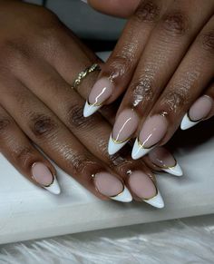 Gorgeous, almond Frenchies with gold line cute for any season #fashion #nails #nailart #nailsofinstagram #frenchnails #gold #bows #newyearnails #newyearnewme Almond French Tip Nails With Gold Line, Almond French White Nails, Black Tip With Gold Line Nails, Golf French Tips Nails, Black French Tip Nails Almond With Gold, New Years Inspo Nails, White French Tip With Gold Chrome, Nails That Go With A Gold Dress, Gold Line French Tip