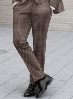 On the hunt for timeless and fashionable pant that guarantees you'll turn heads? Look no further than our Reda Baez Brown Checks Wool Pants. Crafted from pure wool, it gives you natural warmth and unparalleled comfort, showcasing meticulous craftsmanship. This classic pant  is your ticket to making an impression at any event in a professional or social setting.  Look Includes   Reda Baez Brown Checks Wool Fabric  Cross Pocket  Flat Front  Two Welted Back Pockets on Trousers   You can change the Tailored Winter Bottoms With Tapered Leg, Wool Bottoms With Tapered Leg For Fall, Tailored Winter Pants With Belt Loops, Tailored Full-length Dress Pants For Winter, Fall Wool Bottoms With Welt Pockets, Tailored Brown Pants For Winter, Brown Wool Straight Pants, Brown Formal Bottoms For Winter, Classic Brown Winter Pants