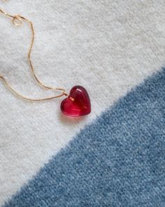 Cute 14k gold filled necklace with a handmade heart resin charm pendant. Wear as a standalone accessory or layer it with other dainty necklaces to add dimension. Chain and pendant included. Actual product color may vary slightly from images shown.  ✦ Material: gold filled, resin ✦ Looking for matching earrings? See https://ellamadeco.etsy.com/listing/1385075499/red-heart-earring-handmade-drop-earring ✦  Care instruction Resin is a soft material, sharp and abrasive items can cause scratches to the surface. Moisture is the main factor that speeds up the tarnishing process. Avoid harsh chemicals including chlorine or salt-water as they can cause damage. To clean, use a soft cloth to gently wipe away any dust or residue. We recommend storing your resin pieces on a soft surface in low humidity Friend Anniversary, Heart Resin, Red Heart Necklace, Red Heart Earrings, Dainty Necklaces, Heart Earring, Earring Handmade, Handmade Heart, Resin Charms