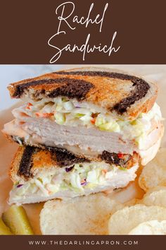 a sandwich cut in half and sitting on top of a plate next to potato chips