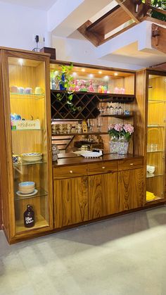 a wooden cabinet with glass doors and shelves