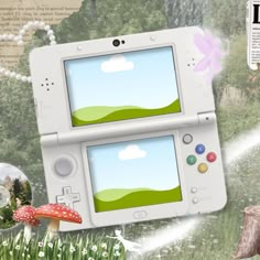 an image of a video game console in the grass with mushrooms and flowers around it