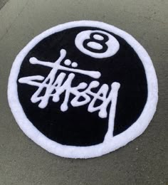 a black and white patch with the number eight on it