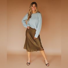 Olive Satin Midi Skirt With Elastic Waist And Fringe Hem. 55% Viscose 45% Rayon Model Is 5'6" And Wearing A Small. Fit Tip: Standard Fit Size Guide For This Item: S: Chest: 34-35" Waist: 27-28" Hips 36-37" M: Chest 36-37" Waist: 29-30" Hips 38-39" L: Chest 38-39" Waist: 31-32" Hips 40-41" Fall Brunch Lined Skirt, Satin Midi Skirt, Women Skirts Midi, Size Guide, Midi Skirt, Elastic Waist, Womens Skirt, Satin, Elastic