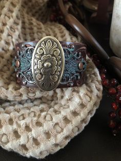 "Country leather bracelet cuff, western jewelry Embossed distressed genuine brown leather 1 1/2\" strap has been adorned with an oval southwestern silver concho which sets on a detailed antiqued copper filigree which has been given a rich patina. It is attached to the leather with two antiqued copper rivets. One antiqued copper snap has been placed to fit up to a 7 1/4\" wrist. I can add another snap if you would like a smaller or larger size but you need to convo me before purchasing The last p Cuff Bracelets Diy, Cowgirl Bracelets, Turquoise Silver Bracelet, Western Bracelets, Looks Country, Chunky Bracelet, Leather Cuff Bracelet, Turquoise Boho, Chunky Bracelets