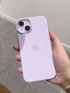 a person holding up an iphone case in their hand, with the camera on it's side