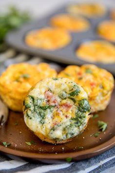 muffins with spinach and cheese on a plate