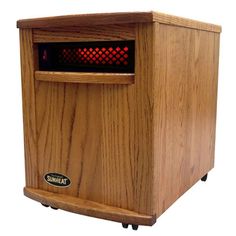 an electric heater sitting on top of a wooden table